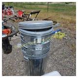Four 20 gal galvi trash cans with lids