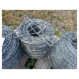 3 partial rolls and one full roll of barbed wire