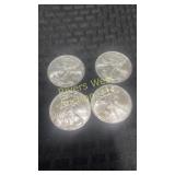 Four 2009 American Eagle silver dollar