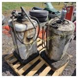 Two vintage air pump greasers