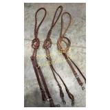 Three pairs of leather reins