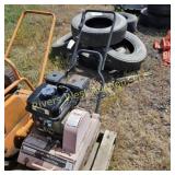Two vibrating plate compactors