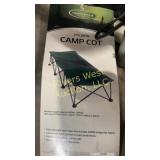 Two green folding cots