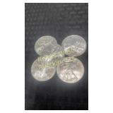 Five 2009 American Eagle Silver Dollars