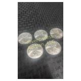 Five 2009 American Eagle silver dollars