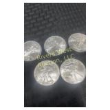 Five 2009 American Eagle silver dollars