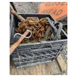 Crate of load chains and ratchet binder