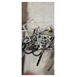 Tote full of metal shelving brackets and hangers.