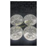 Four 2009 American Eagle Silver Dollars