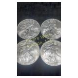 Four 2009 American Eagle Silver Dollars