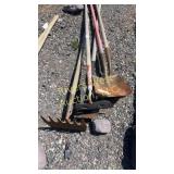 Assortment of hand shovels and concrete tools
