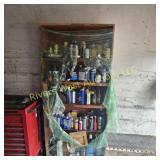 Wooden shelf filled with misc. lubricants
