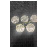 Five  2009 American Eagle silver dollars