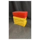 3 containers with bullets or shells. 1 red