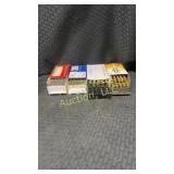 4 boxes of ammunition and shells. 4 boxes of misc