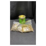 2 bags and 1 tin can full of cartridge casings. 2