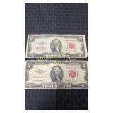 Two 1953 two dollar bills in red ink