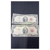 Two 1963 two dollar bills in red ink