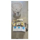 Bucket full of John Deere parts and chain segment