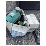 Box full of lawn ornaments
