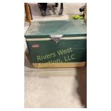 Green antique Coleman cooler.