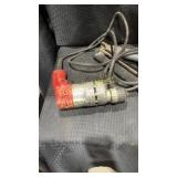 2 power tools. A red Milwaukee electric drill. A