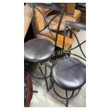 Two different height bar stools one is