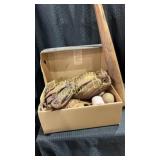 Box of old baseball gear and a bat. 3 different