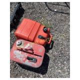 Two boat motor gas cans