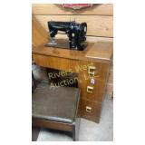 Vintage signer sewing machine and cabinet