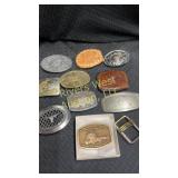 Wooden box full of 11 western belt buckles
