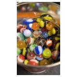 Vintage marbles in a vintage coffee can. Hills