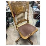 Antique rocking chair on wheels