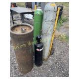 Two oxygen tanks two acetylene tanks and cart