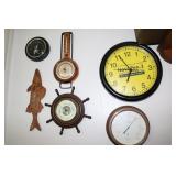 Lot of barometers and thermometers and a clock