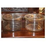 2 large round glass containers with lids similar