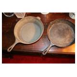 2 Ccast Iron fry pans,  one is Lodge 8CF