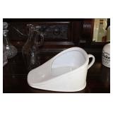 32 oz urinal and an antique porcelain bed pan