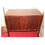 Wooden cabinet on wheels with felt inside