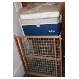 Igloo cooler, cushion, crab pot and wooden gate