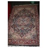 49 1/2" x 77" White, blue and red rug
