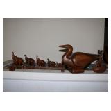 Wooden elephant family (some have broken tusks),