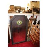 Mirror with trophy design at top and lamp