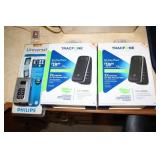 2 Tracfones new in box and a Phillips universal