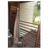 Umbrella, wooden firkin, planters, round glass