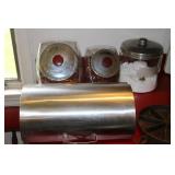 Stainless steel breadbox and a 3 glass canisters