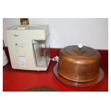 Oster juice extractor and a copper top cake plate