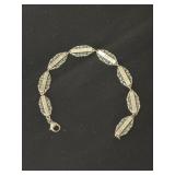 Charm bracelet marked JCF Ster