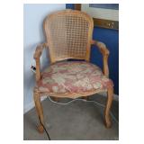 Carved French style cane back armchair