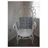 White wicker accent chair with throw pillow (has